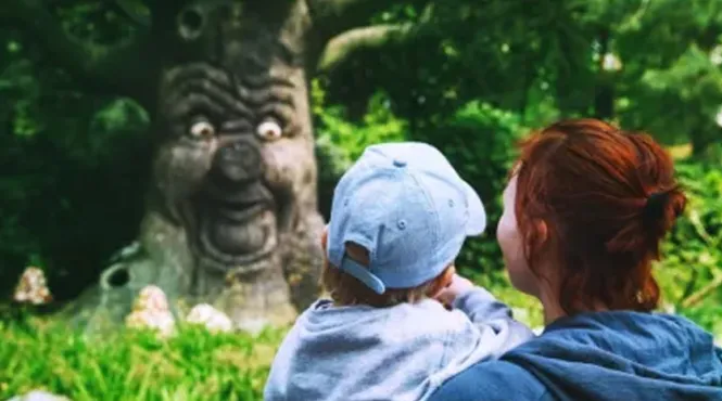 mother and child looking at mythical tree