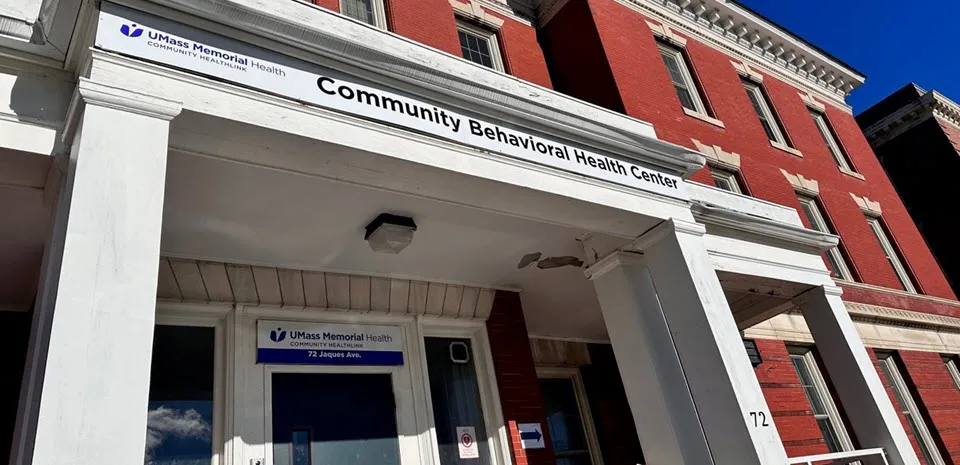 A closeup of the white entryway of Community Healthlink Community Behavioral Health Center at 74 Jaques Avenue in Worcester.