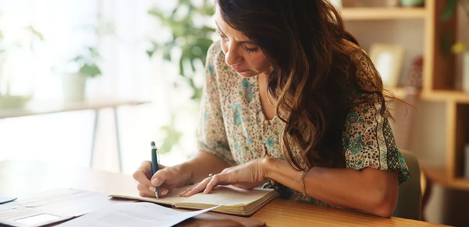 woman writing in her journal