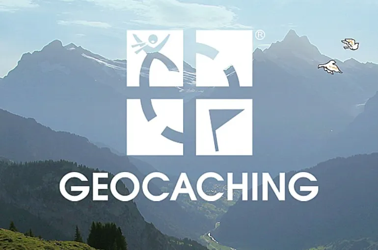 A mountain range is shown with the text 'Geocaching' and the Geocaching.com logo.