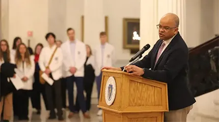 Dr. Kiame Mahaniah, the state's undersecretary of Health and Human Services speaks to physician assistant students during a Lobby Day at the State House on April 1.