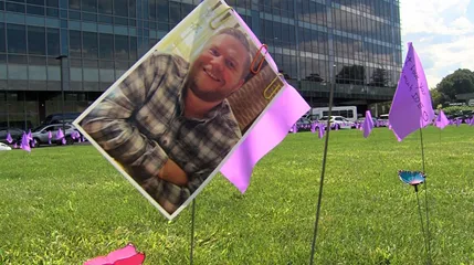 A photo of Adam Faust on the UMass Memorial campus green during Wednesday’s observance of Overdose Awareness Day.