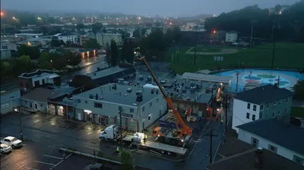 Work crews removing a 13,000 pound magnet at the 214 Shrewsbury Street location of the MRI facility.