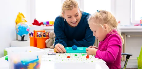 adult painting with child