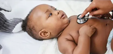 baby receiving a doctor check-up
