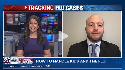 Dr. Zachary Binder speaks about the flu during an interview.