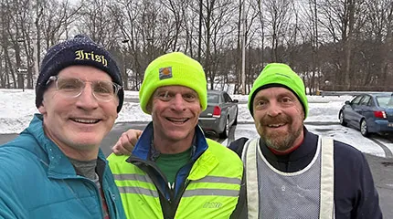 John Kelly, middle, is one of five Boston Marathon runners in 2025, raising $25,000 for ALS research at UMass Chan Medical School.