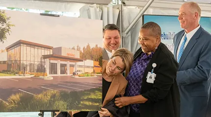 Looking at a rendering of the planned satellite emergency facility in Groton are, from left, UMass Memorial Medical Center President, Justin Precourt, Massachusetts Governor, Maura Healey, UMass Memorial Health Chief Operating Officer Cynthia Barginere and UMass Memorial Health President and CEO, Dr. Eric Dickson