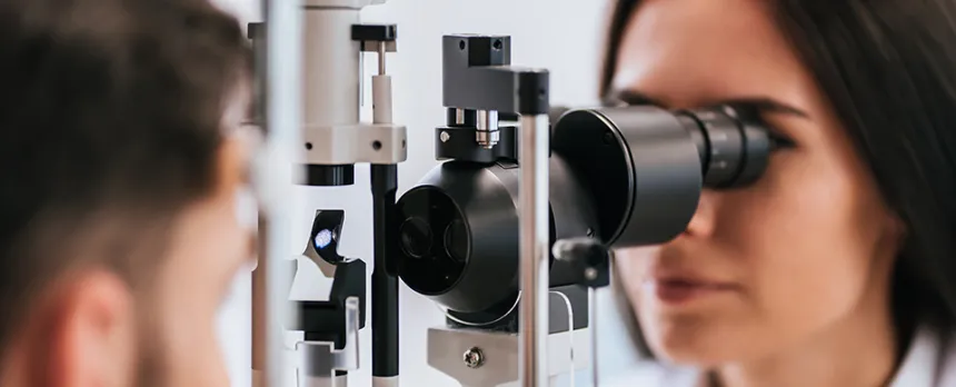 female doctor examining patients eyes