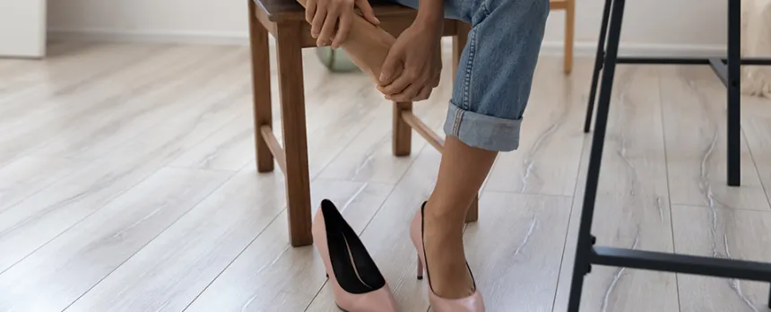 woman taking off her heels